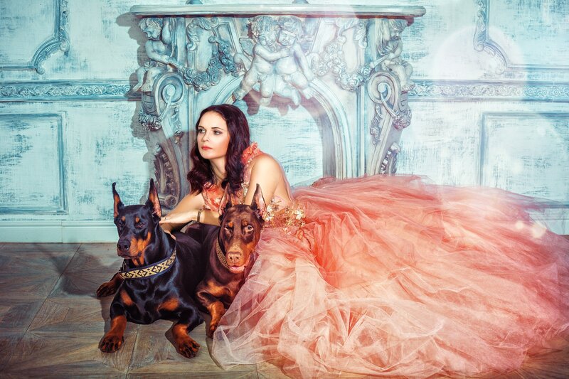 Woman with Two Dobermans