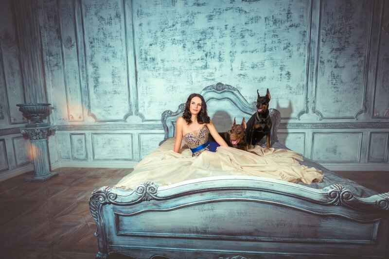 Woman with Two Dogs on Bed — Blue