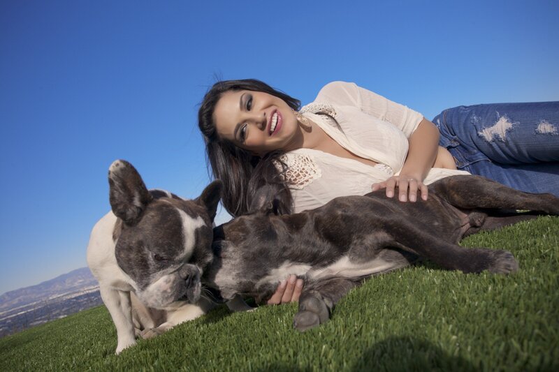 Woman with two dogs on grass
