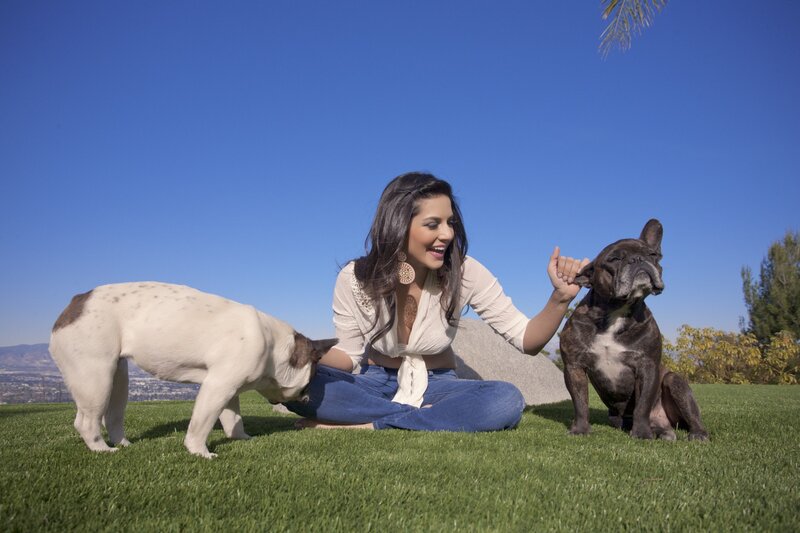 Woman with two dogs on grass