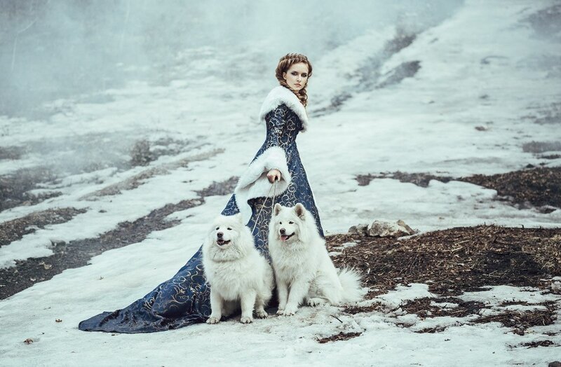 Woman with Two Dogs — White, Dramatic, Winter, Photograph