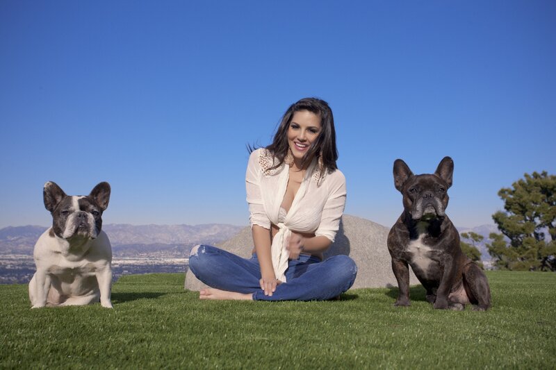 Woman with two French bulldogs
