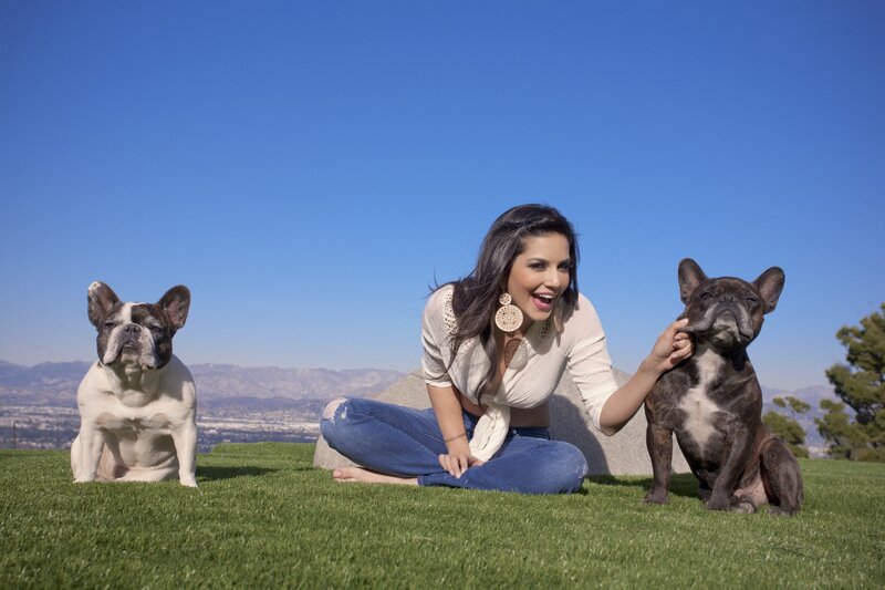Woman with two French bulldogs
