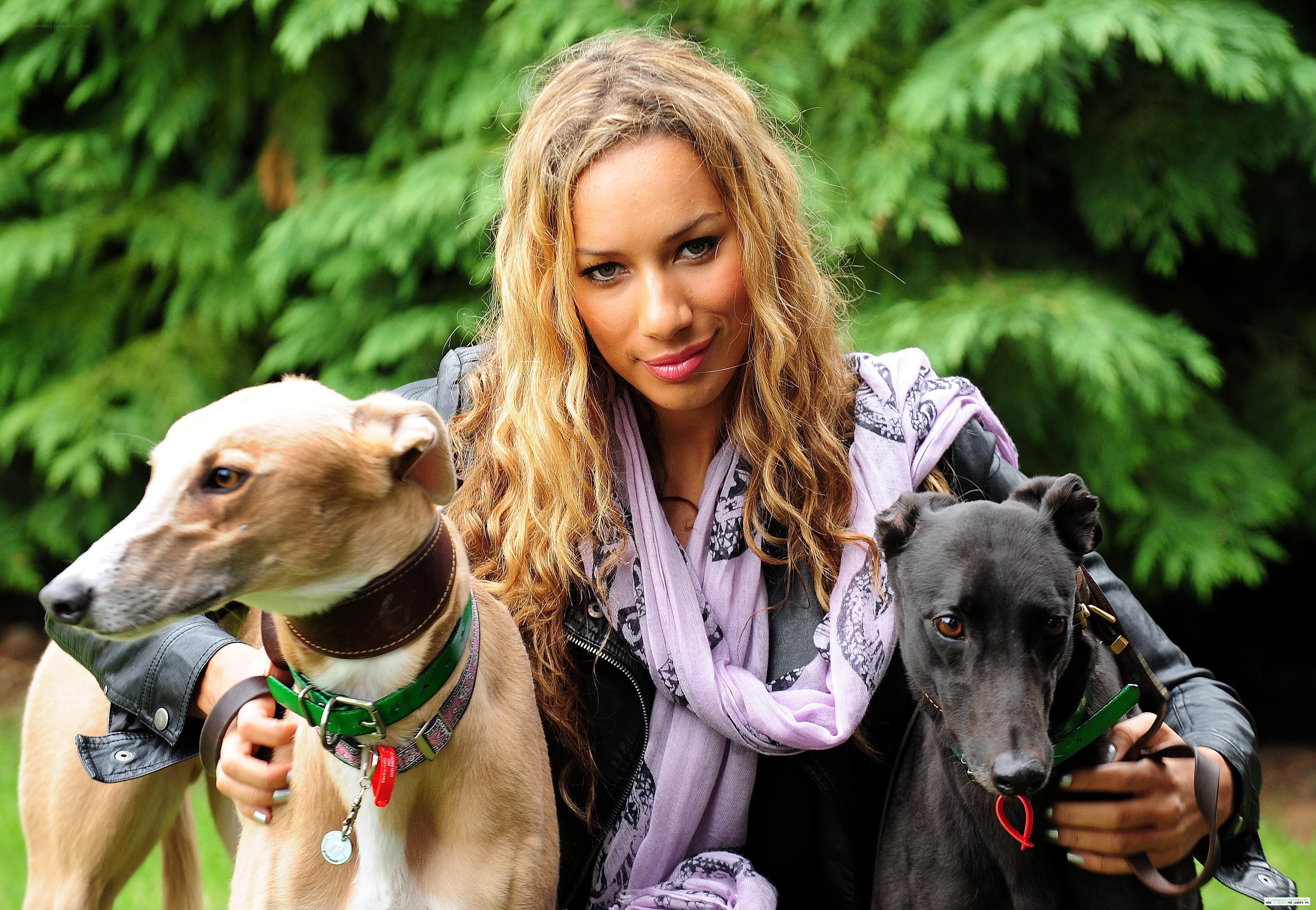 Woman with two greyhounds