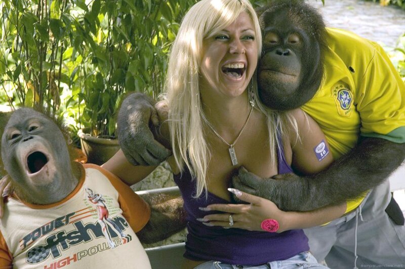 Woman with Two Orangutans