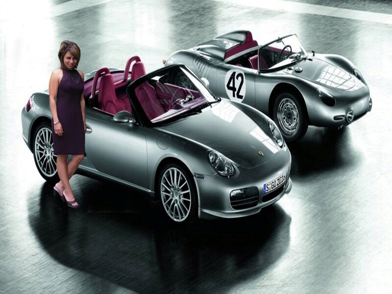 Woman with two silver sports cars