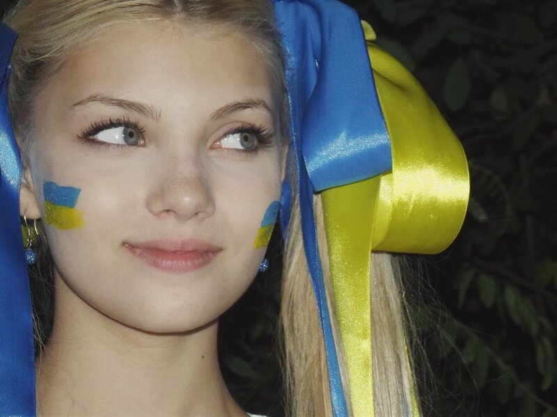 woman with ukrainian flag face paint