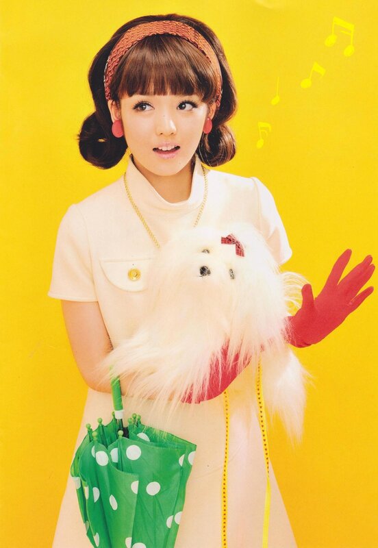 woman with umbrella and plush toy