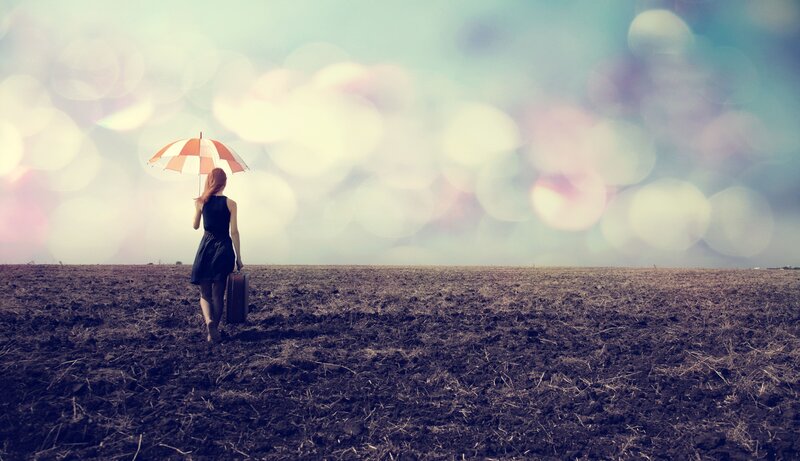 Woman with Umbrella and Suitcase