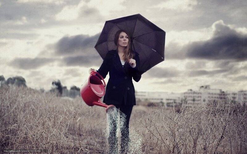 woman with umbrella and watering can