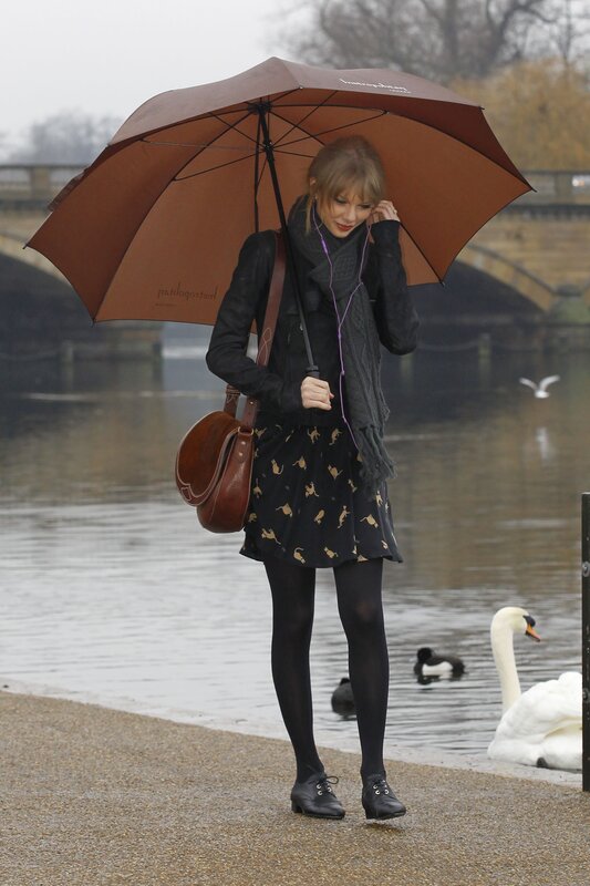 woman with umbrella by river