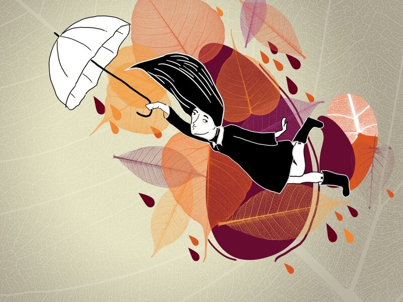woman with umbrella in autumn leaves