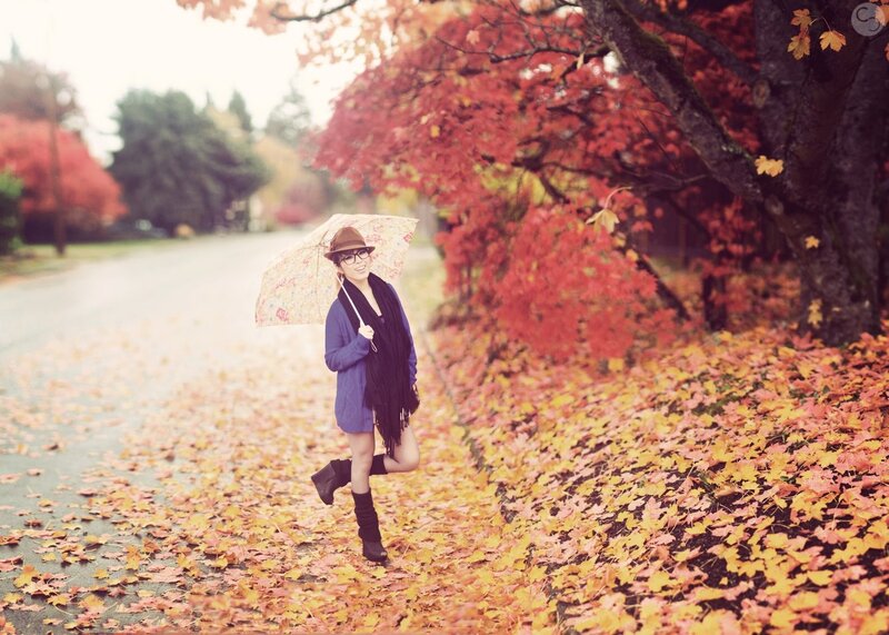 Woman with umbrella in autumn