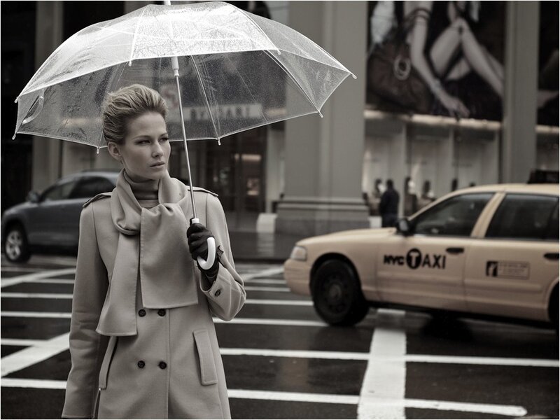 Woman with umbrella in city