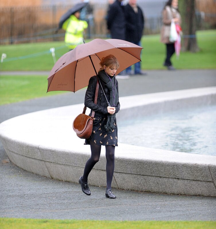 Woman with umbrella in park