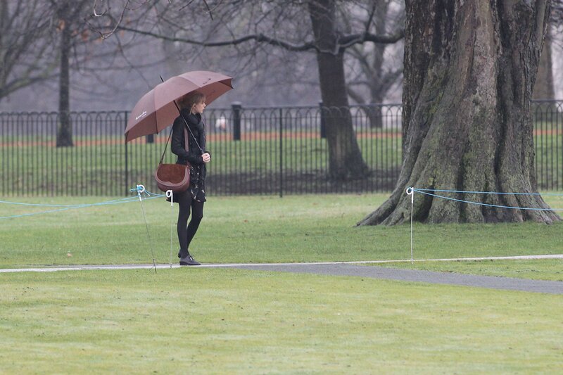 Woman with umbrella in park