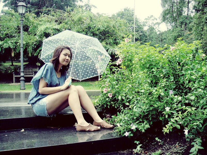 Woman with umbrella in park