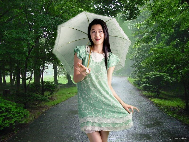Woman with umbrella in park