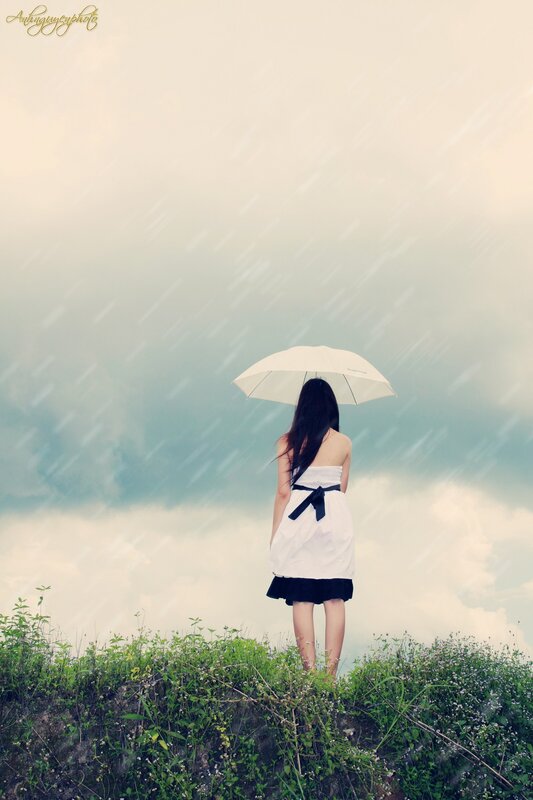 Woman with umbrella in rain