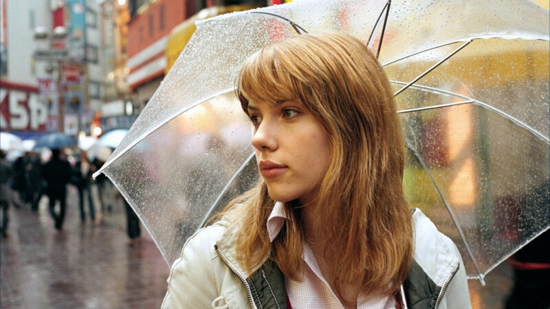 woman with umbrella in rain