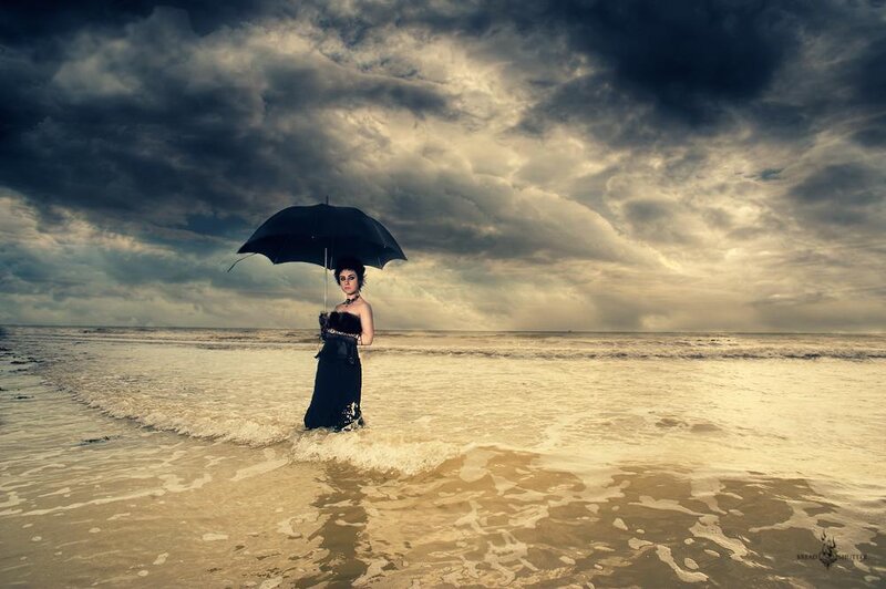 Woman with Umbrella on Beach
