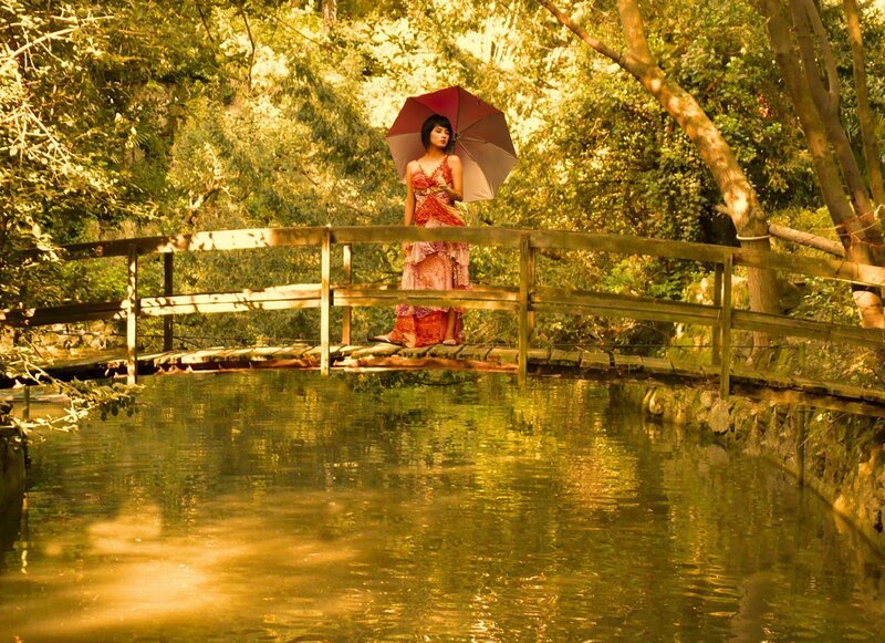 Woman with Umbrella on Bridge — Green