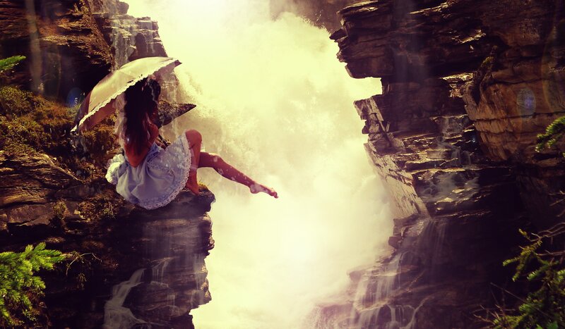 Woman with Umbrella on Cliff