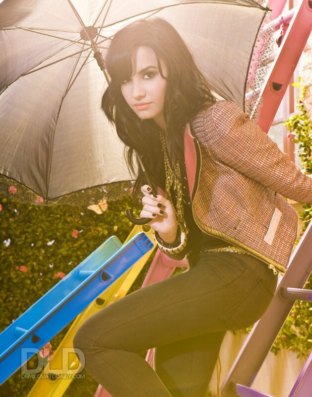 woman with umbrella on ladder