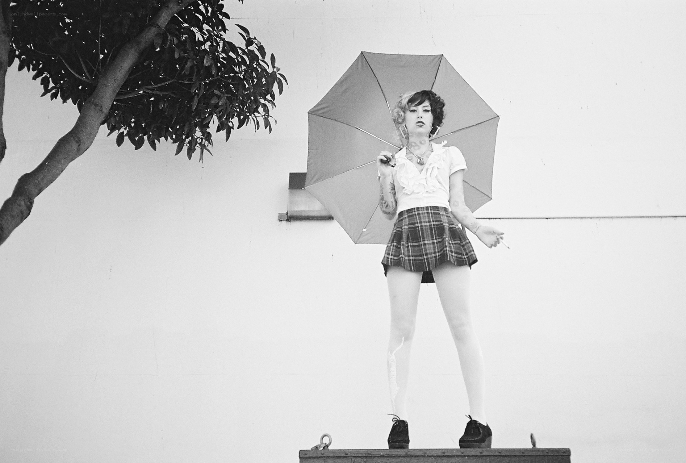 woman with umbrella on platform