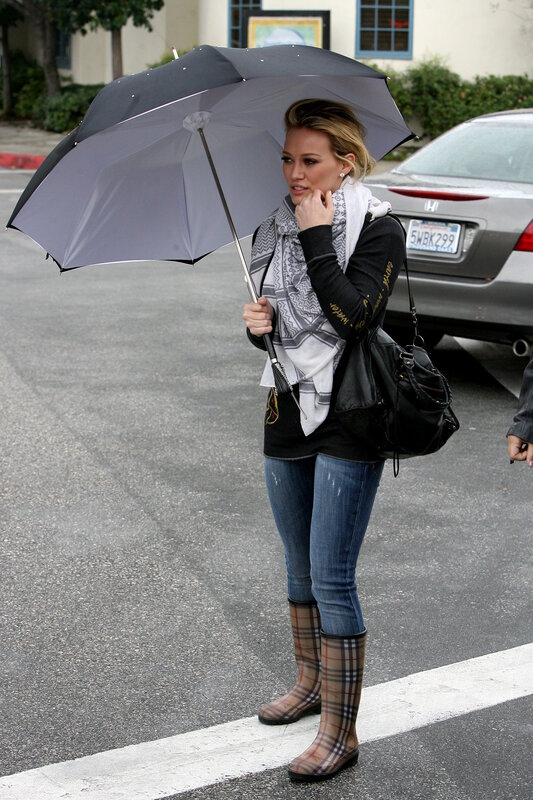 Woman with umbrella on street
