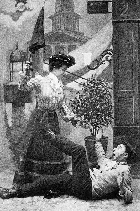 Woman with umbrella over man