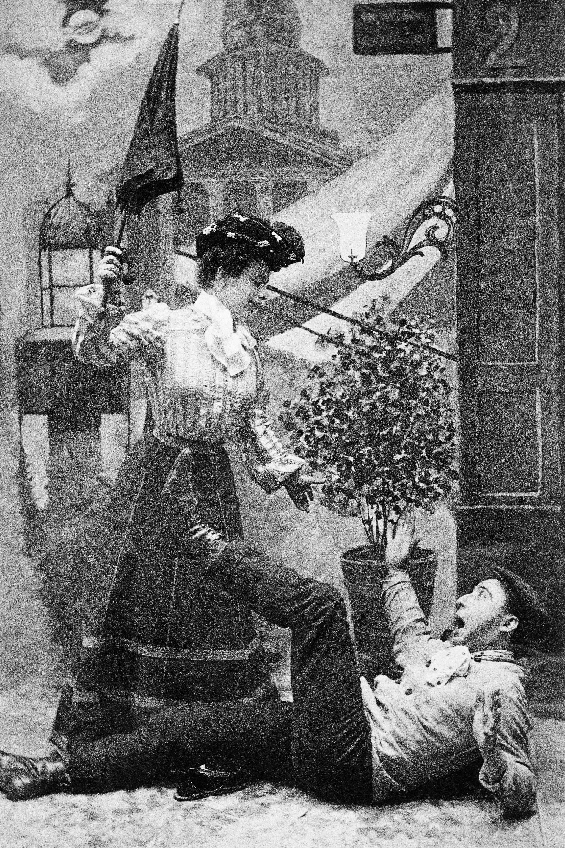 Woman with umbrella over man