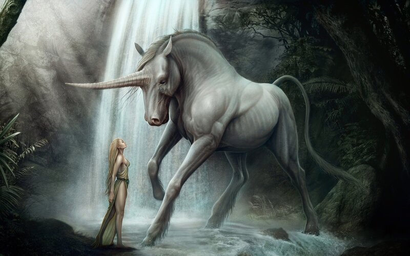 woman with unicorn at waterfall
