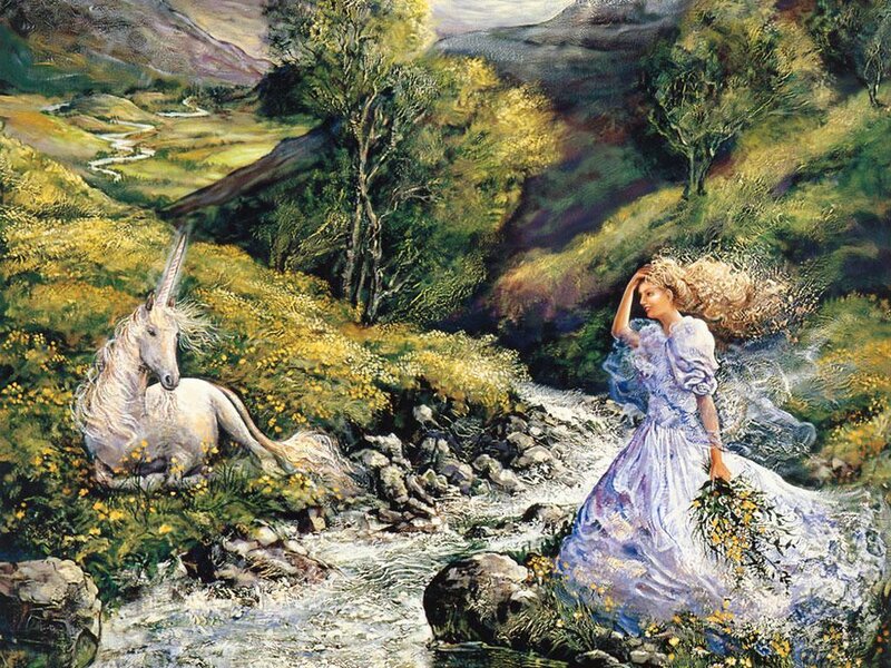 Woman with unicorn in a valley