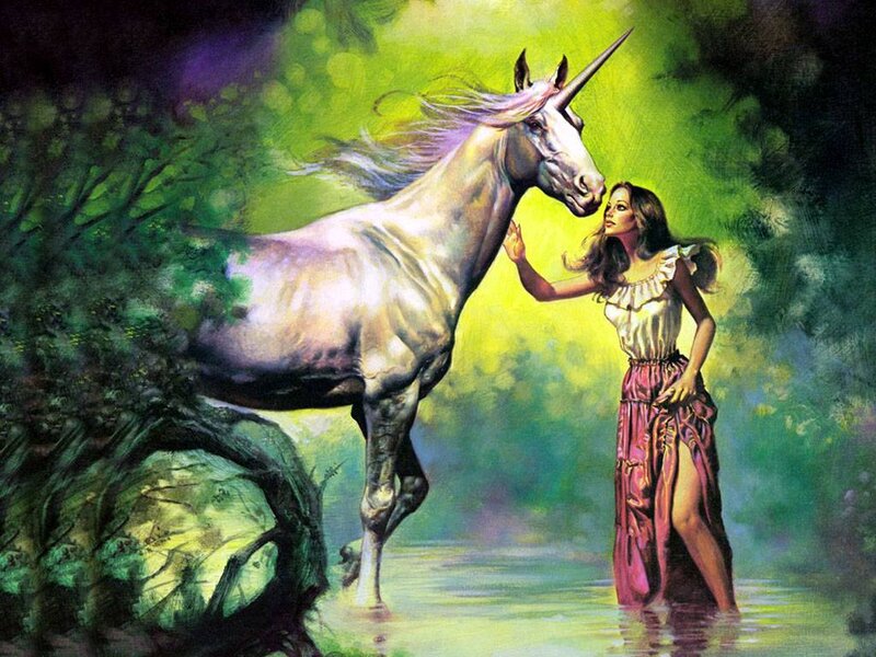 woman with unicorn in forest