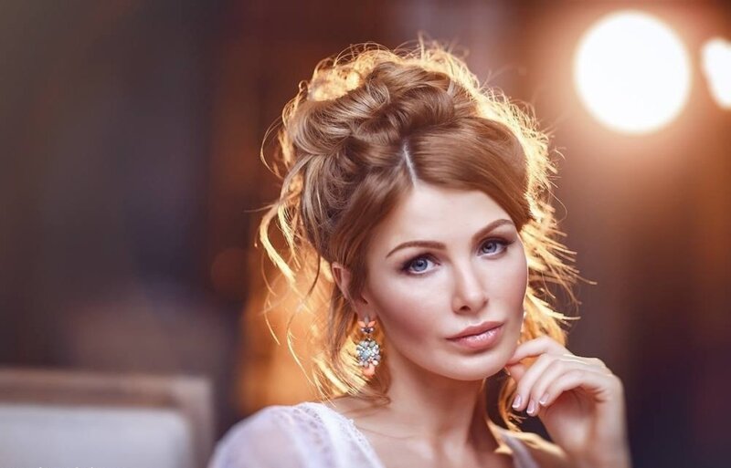 Woman with Updo Hairstyle — Brown, Dramatic, Photograph, Earrings