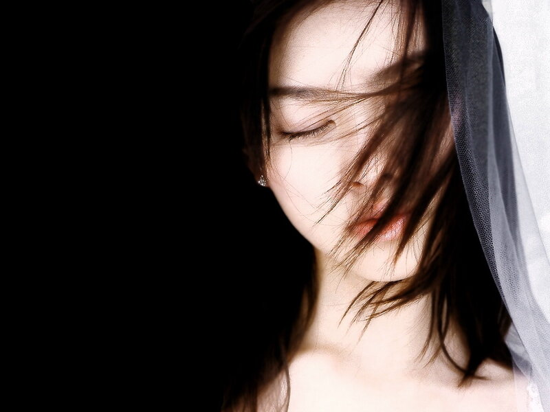 woman with veil and closed eyes