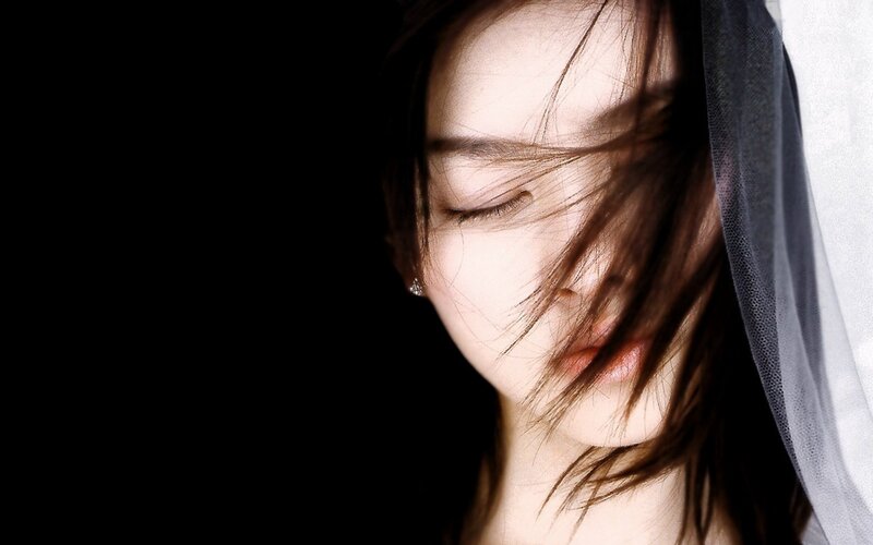 woman with veil and closed eyes