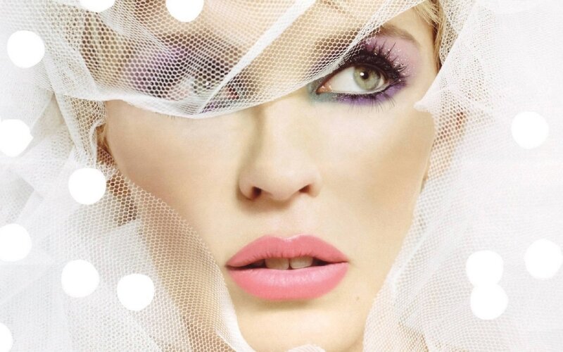 woman with veil and colorful makeup