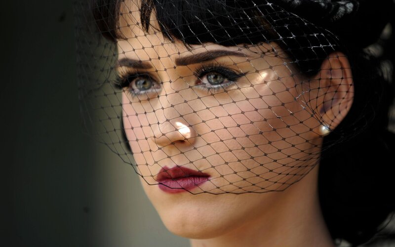 woman with veil and dramatic makeup