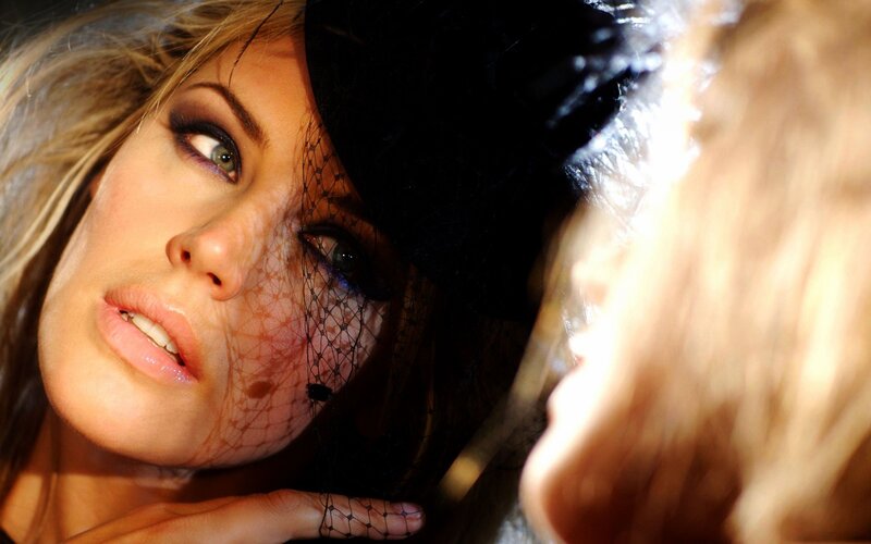 woman with veil and dramatic makeup