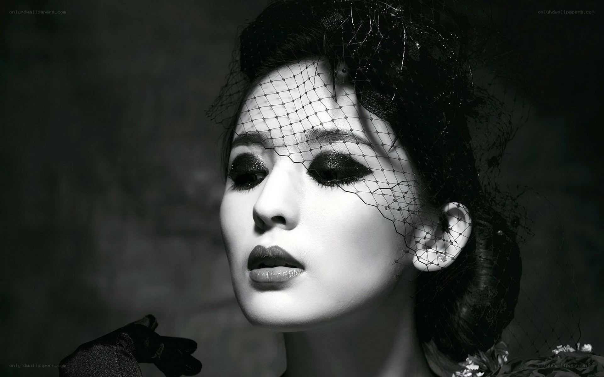 woman with veil and dramatic makeup