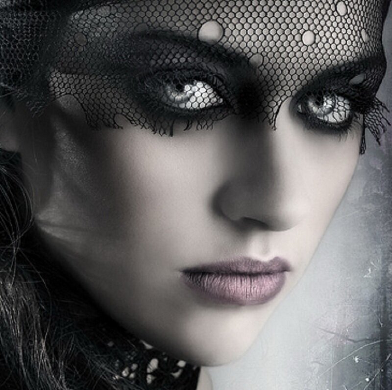 woman with veil and dramatic makeup