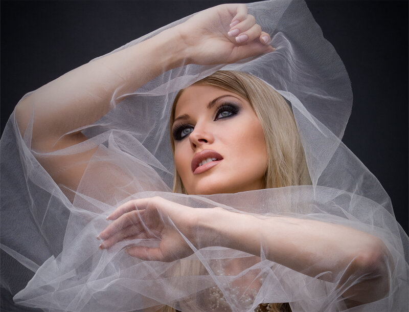 woman with veil and dramatic makeup