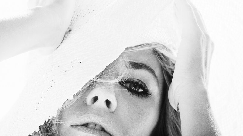 woman with veil covering face