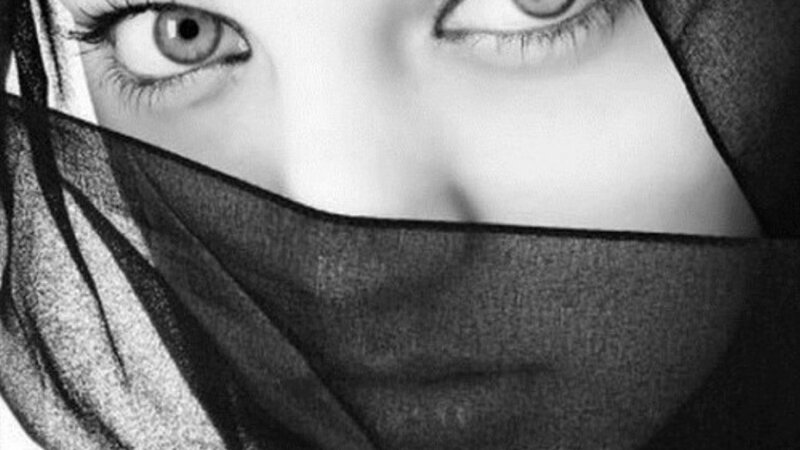 woman with veil covering face
