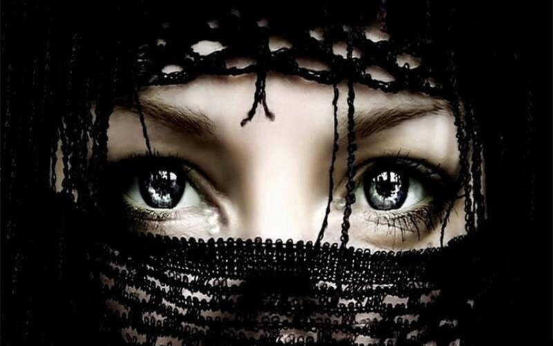 woman with veil covering face
