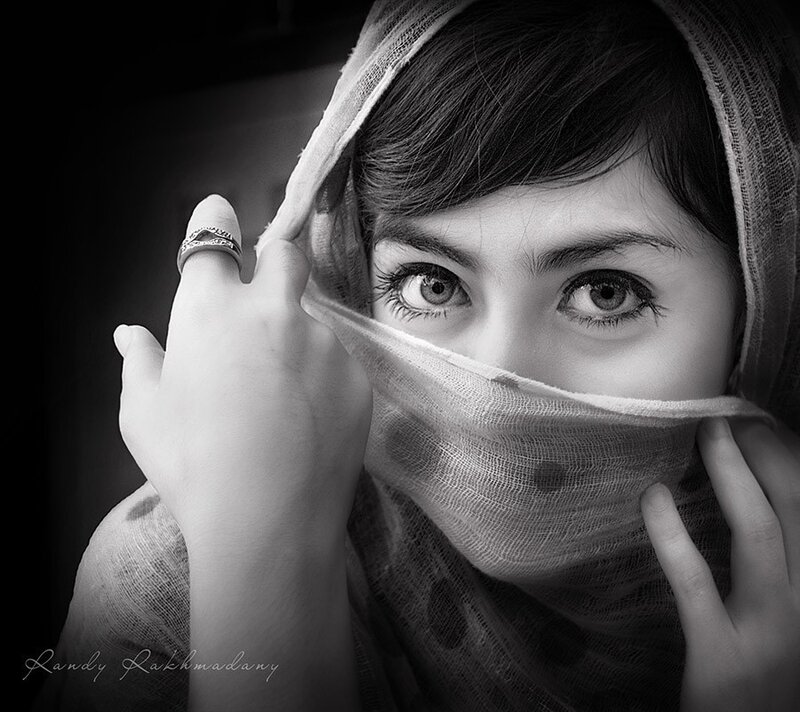 woman with veil covering face