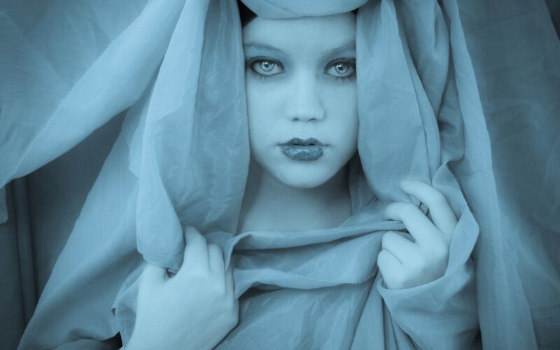 woman with veil in blue light