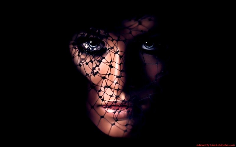 woman with veil in darkness